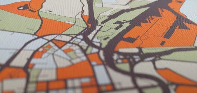 Close-up of a MappyThoughts canvas print showing a colored city map